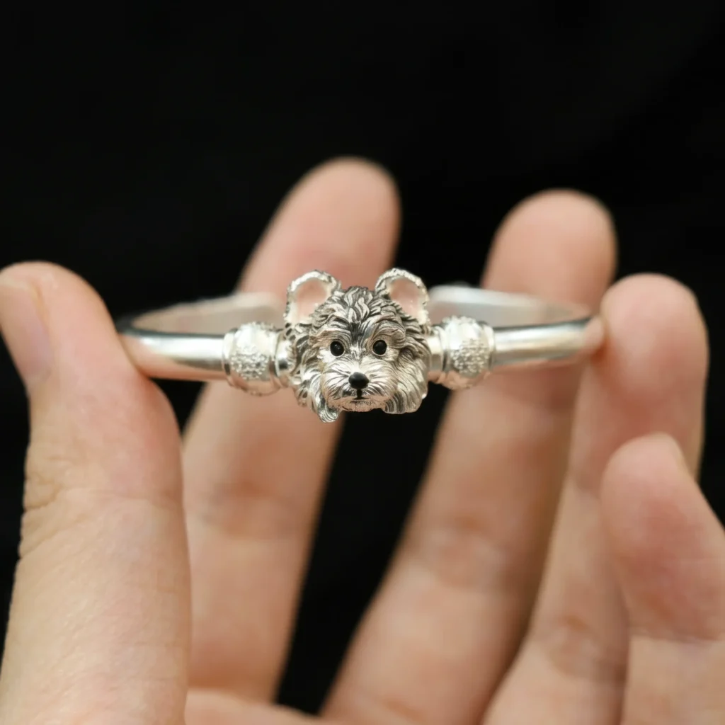 hand holding custom 3d sterling silver dog portrait cuff bangle bracelet