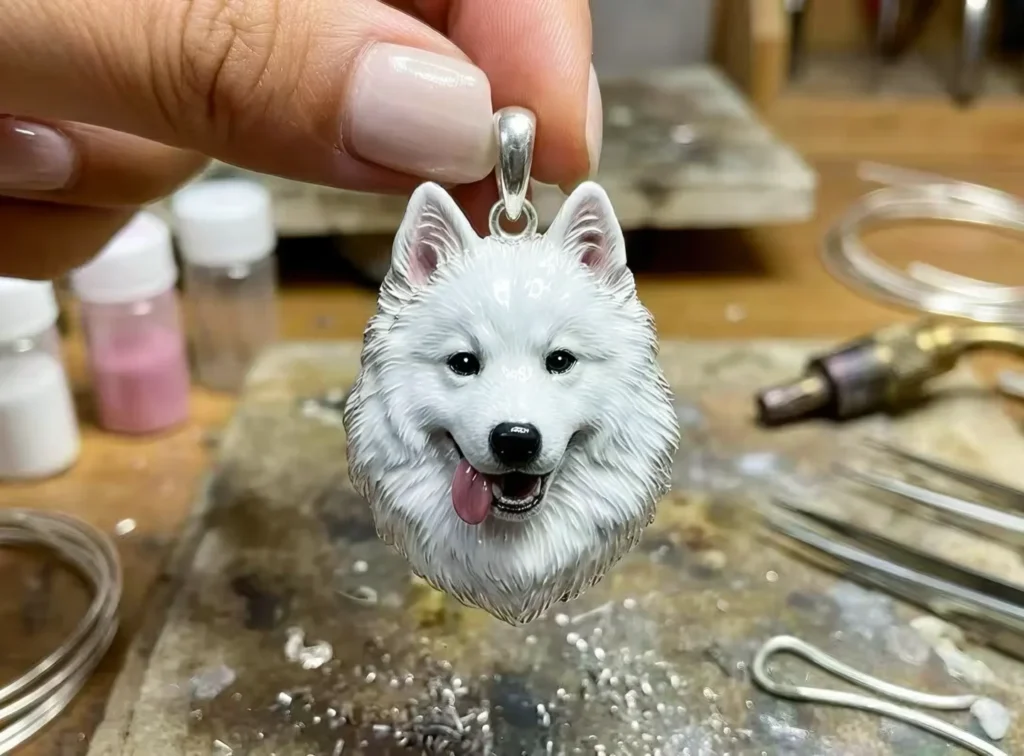 How It Works wove paw artisan holding hand sculpted 925 sterling silver white dog pendant in workshop